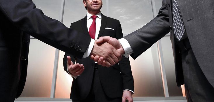 in the foreground.business handshake business partners .\the concept of cooperation