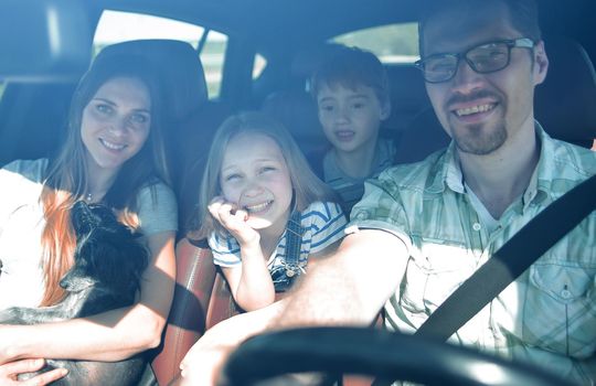 happy family rides in the car.the concept of freedom and travel