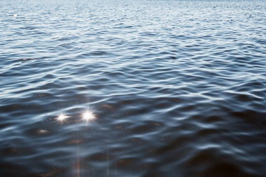 The texture of the blue lagoon water shines in the sun