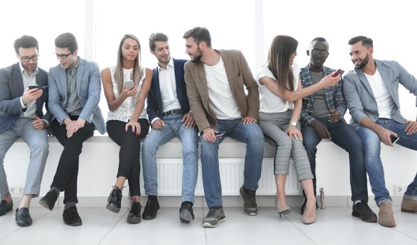 group of young people communicate in the waiting room.photo with copy space