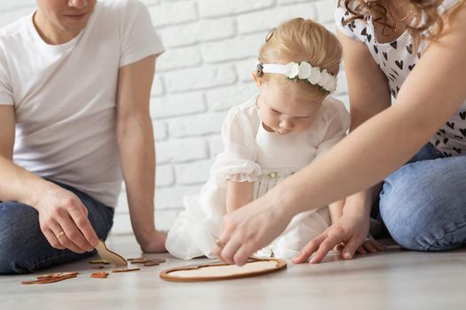 Mother holds her child with hearing aids and cochlear implants . Deaf and health