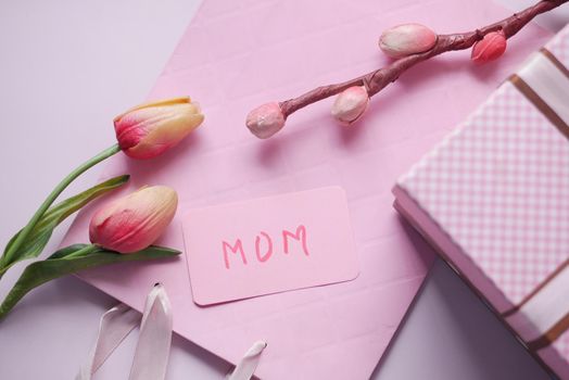 f mother day gift and flower on table..