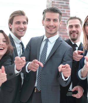 Business team is using putting fingers together and smiling while working in office