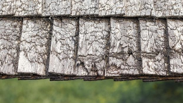 Traditional old wooden grey colour tiled roof