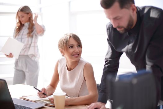 young business woman sitting at office Desk. people and technology