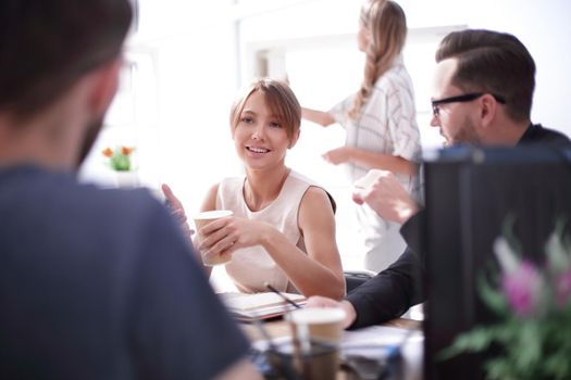 young business woman sitting at office Desk. people and technology