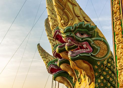 Krabi, Thailand- March 29 2019: Tiger temple buddha guard decorative dragoon statue, for head snake
