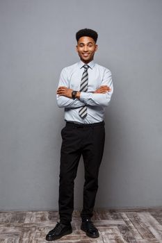Business Concept - Full length portrait of confident african american businessman in the office