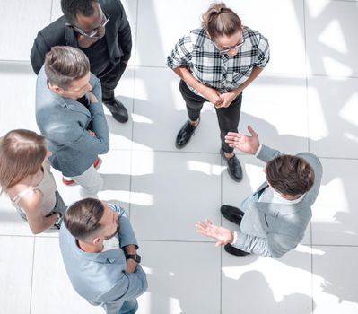 company executives talking to diverse workers listening instructions at break