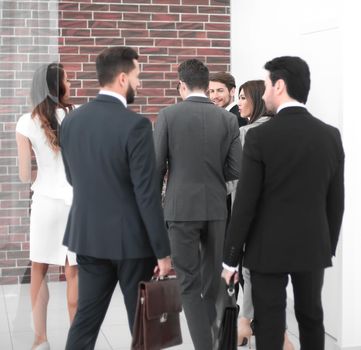 group of business people talking, standing in the lobby of the business center.photo with copy space
