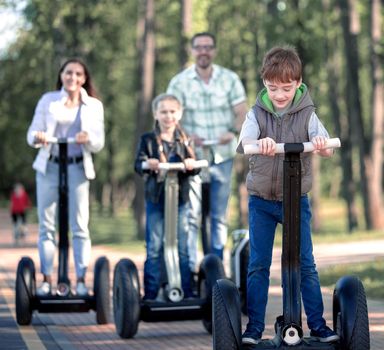 cheerful family spends time in the city Park. We go together.