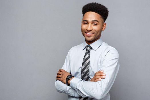 Business Concept - Happy professional african american businessman confident arms crossed