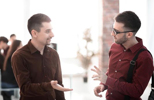 closeup.two colleagues talking in office