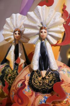 Alicante, Spain- May 12, 2022: Vintage cardboard figurines of fallera women in traditional costumes exhibited in The Hogueras Museum of Alicante
