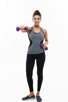 Healthy and Fitness concept - Full-length of portrait Beautiful American African lady in grey fitness clothes workout with dumbbell. Isolated on white background