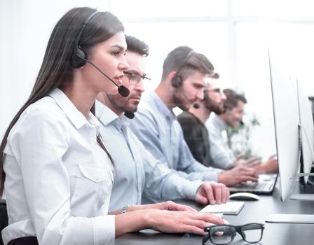 background image of the call center employee in the workplace
