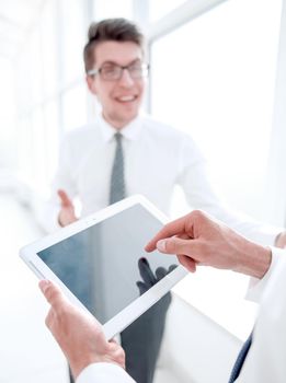 close up.employees discuss standing in the hallway of the office. office weekdays