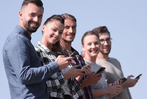 group of young people with modern smartphones. communication concept