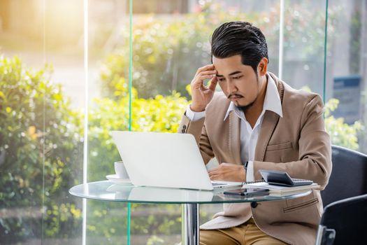 young stressed business man using laptop and working problem 