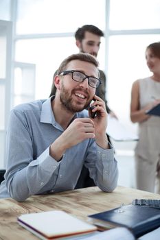 business man talking to a client on a smartphone. people and technology