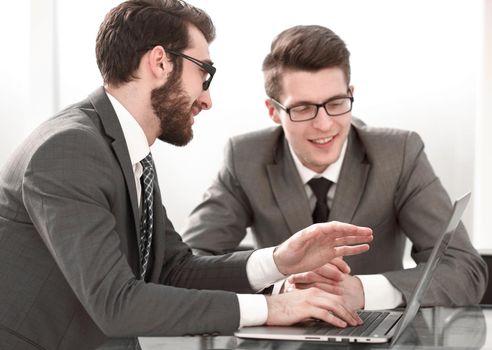 close up.two business people sitting at the Desk.people and technology