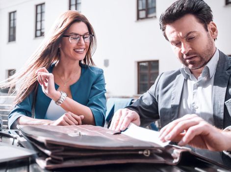 close up.business partners sit at a table on the street,