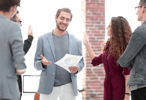 Business: Team having a serious argument, one colleague being the mediator