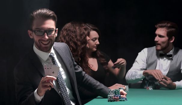 background image. game of poker. players sitting at a green gaming table