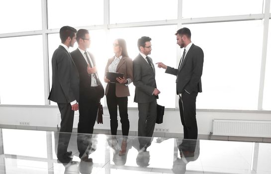 photos of businessmen in a conference room with morning light.