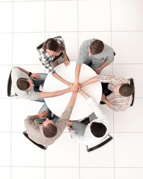 top view.single business team sitting at the round table .photo with copy space