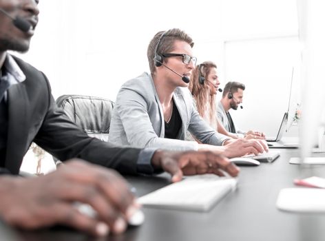 call center staff work in a modern office. photo with copy space