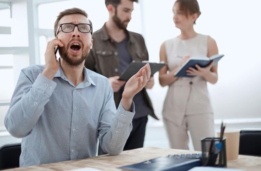 business man talking to a client on a smartphone. people and technology