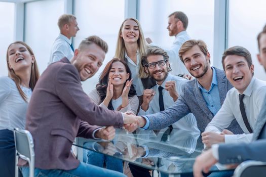 happy business people shaking hands in the conference room . photo with copy space