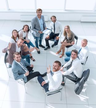 top view. business training participants sitting in a circle and looking at the camera