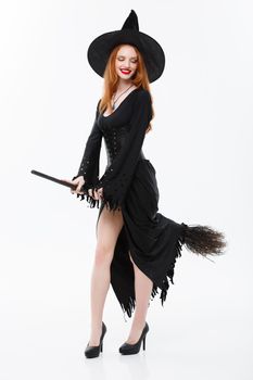 Halloween Witch Concept - Full-length Happy elegant witch with broomstick for celebrating halloween party over white background