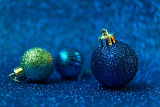 Christmas tree decorations on a shiny background. Vibratory focus. Holiday.