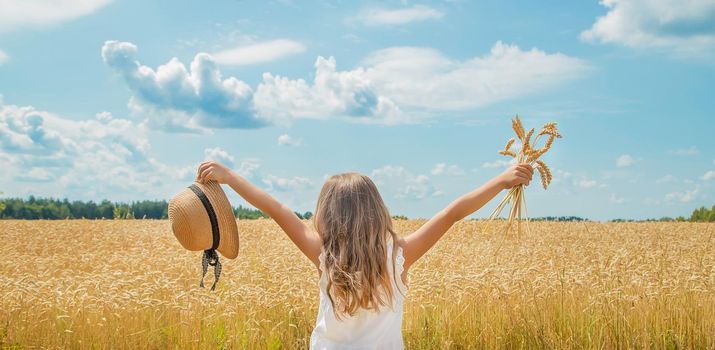 A child in a wheat field. Selective focus. nature.