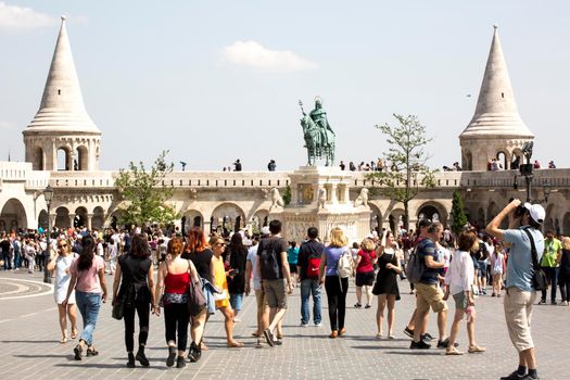 Budapest, BD, 29.04.2018: Group of tourists visiting the Trinity square in Budapest