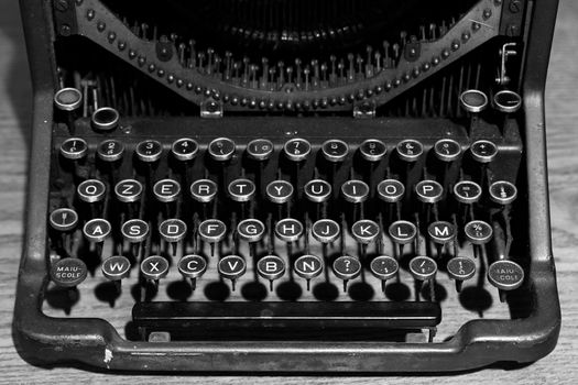 Old typewriter photographed from the front, you see the letter keys.