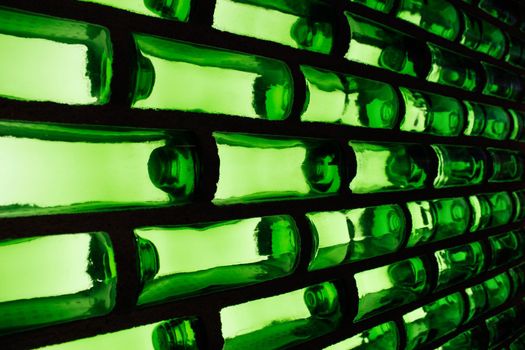 A wall of green glass that creates a graphic pattern.