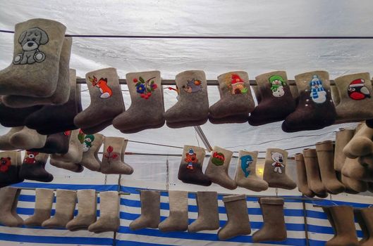 Felt boots on market stand. Valenki are traditional Russian winter footwear.frost