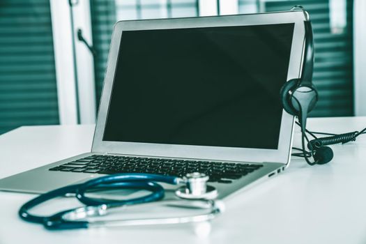 Headset and doctor equipment at clinic ready for actively support for patient by online video call . Concept of telehealth and telemedicine service .
