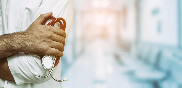 Young male doctor working at the hospital. Medical healthcare and doctor staff service.