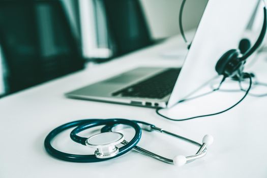 Headset and doctor equipment at clinic ready for actively support for patient by online video call . Concept of telehealth and telemedicine service .