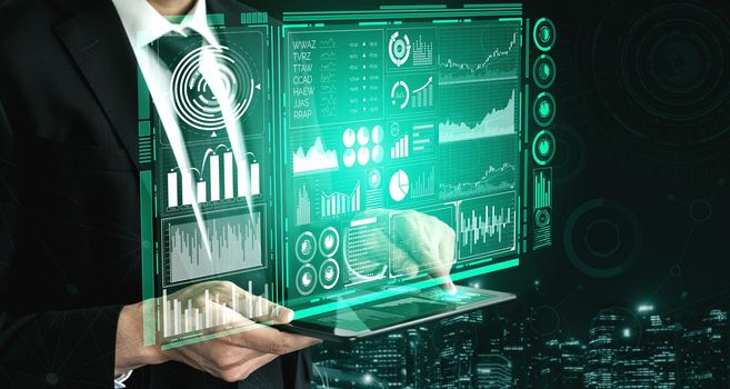 Big Data Technology for Business Finance Analytic Concept. Modern graphic interface shows massive information of business sale report, profit chart and stock market trends analysis on screen monitor.