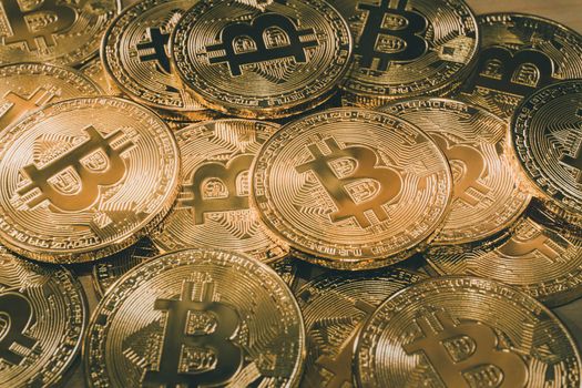 Physical Bitcoin pile background - Bitcoin mining business is the process of adding transaction records to Bitcoin public ledger of past transactions or blockchain. Cryptocurrency trading concept.