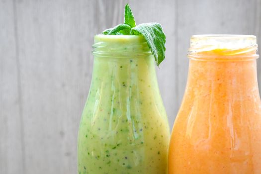 Seasonal Matcha green vegan smoothie with chia seeds and mint pumpkin carrot smoothie drink detox Breakfast. Clean eating, weight loss, healthy dieting food concept Fruit vegetable drink fitness