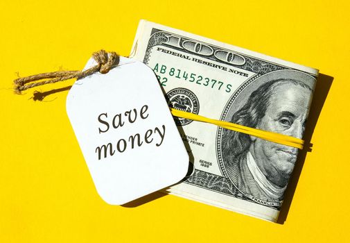 Paper note written text SAVINGS. Save money. Save today for tomorrow Dollar banknotes. Money, Business, finance, investment, saving. Cash bill. Business budget of wealth and prosperity finance