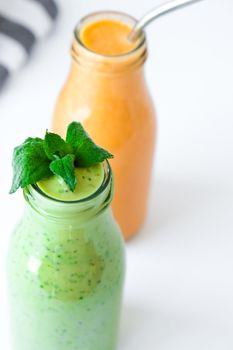 Seasonal Matcha green vegan smoothie with chia seeds and mint pumpkin carrot smoothie drink detox Breakfast. Clean eating, weight loss, healthy dieting food concept Fruit vegetable drink fitness