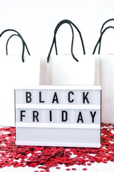Lightbox with text BLACK FRIDAY with paper shopping bags on white background, Sale shopping concept. Online shopping Template Black friday sale mockup fall thanksgiving promotion advertising Big sale. Cyber monday. Holiday